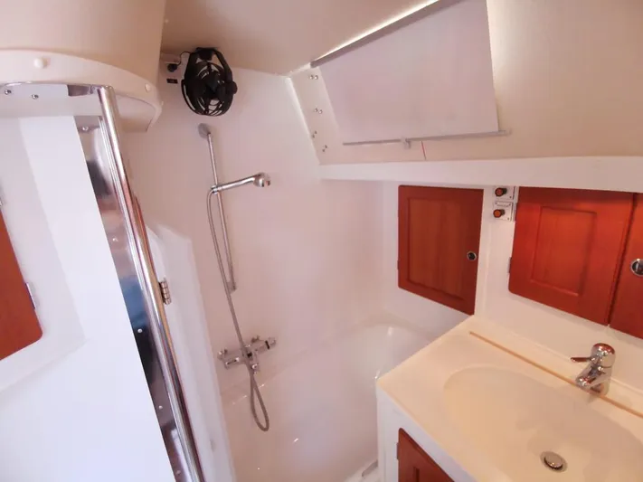  Yacht Photos Pics Bathroom interior of 2004 Hallberg-Rassy 62 yacht with shower and sink.