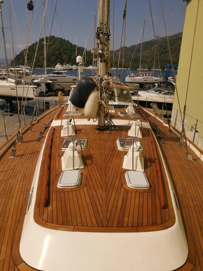  Yacht Photos Pics 2004 Hallberg-Rassy 62 sailboat with teak deck, docked in a marina.