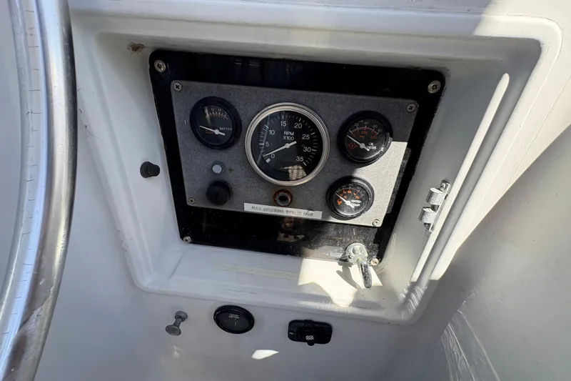 Skye Yacht Photos Pics Control panel of a 1990 Beneteau Oceanis 500 sailboat with gauges and switches.