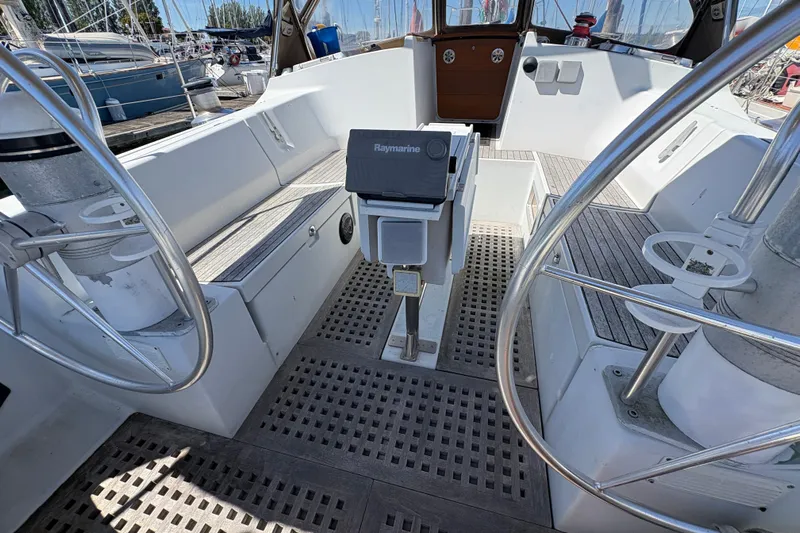 Skye Yacht Photos Pics 1990 Beneteau Oceanis 500 yacht cockpit with dual steering wheels and Raymarine equipment.