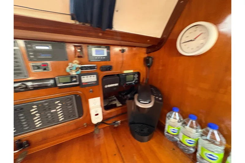 Skye Yacht Photos Pics Interior of 1990 Beneteau Oceanis 500 yacht with navigation equipment and coffee maker.