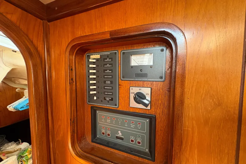 Skye Yacht Photos Pics Control panel on 1990 Beneteau Oceanis 500 yacht, featuring switches and gauges.