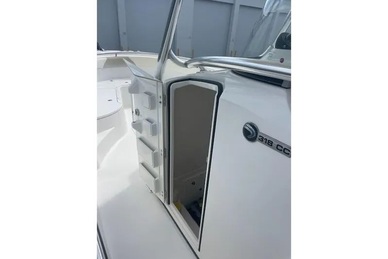 T/t Aloan At Last Yacht Photos Pics 2015 Edgewater 318CC boat interior with open storage compartment.