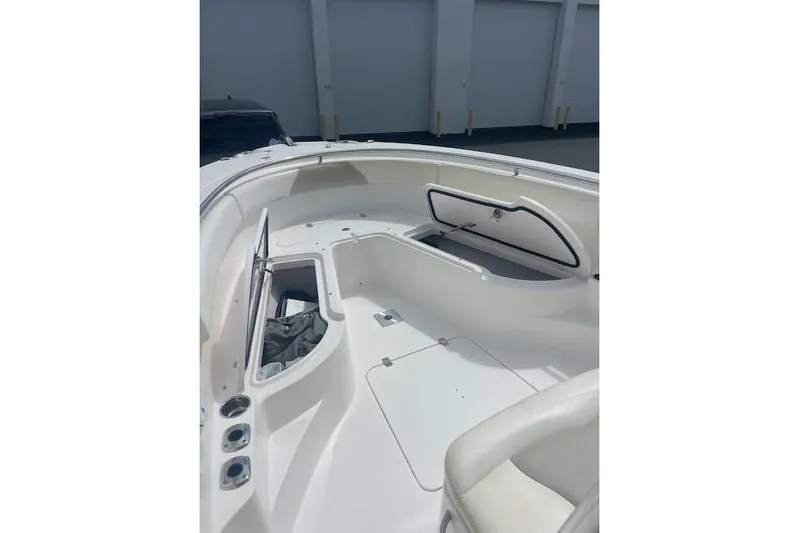 T/t Aloan At Last Yacht Photos Pics 2015 Edgewater 318CC boat interior with open storage compartments and seating.