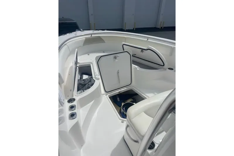 T/t Aloan At Last Yacht Photos Pics 2015 Edgewater 318CC boat interior with open storage compartments.