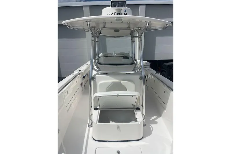 T/t Aloan At Last Yacht Photos Pics 2015 Edgewater 318CC boat interior with open storage compartment and T-top.
