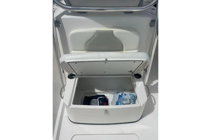 T/t Aloan At Last Yacht Photos Pics 2015 Edgewater 318CC boat storage compartment with open lid, showing interior items.