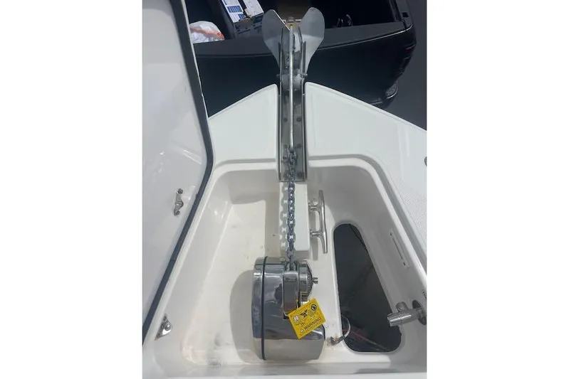 T/t Aloan At Last Yacht Photos Pics Anchor system of a 2015 Edgewater 318CC boat, featuring a chain and winch.