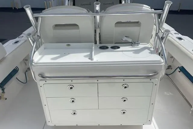 T/t Aloan At Last Yacht Photos Pics 2015 Edgewater 318CC boat interior with storage drawers and seating area.
