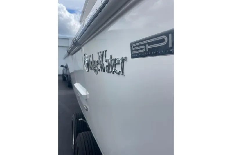 T/t Aloan At Last Yacht Photos Pics 2015 Edgewater 318CC boat side view with logo and SPI badge.