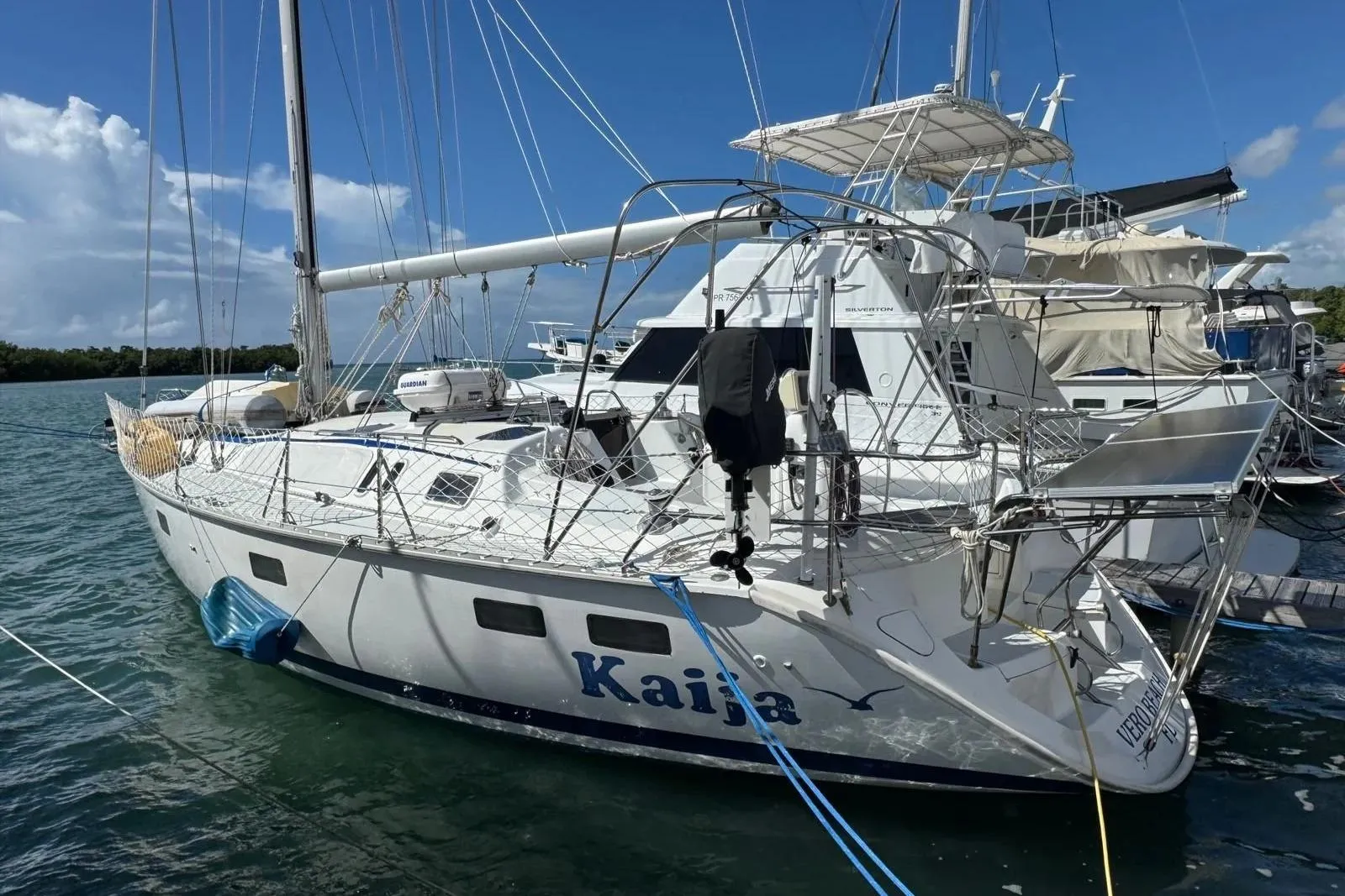 Sailboat "Kaija" docked, 1994 Hunter Legend 40.5, sunny day, marina background.