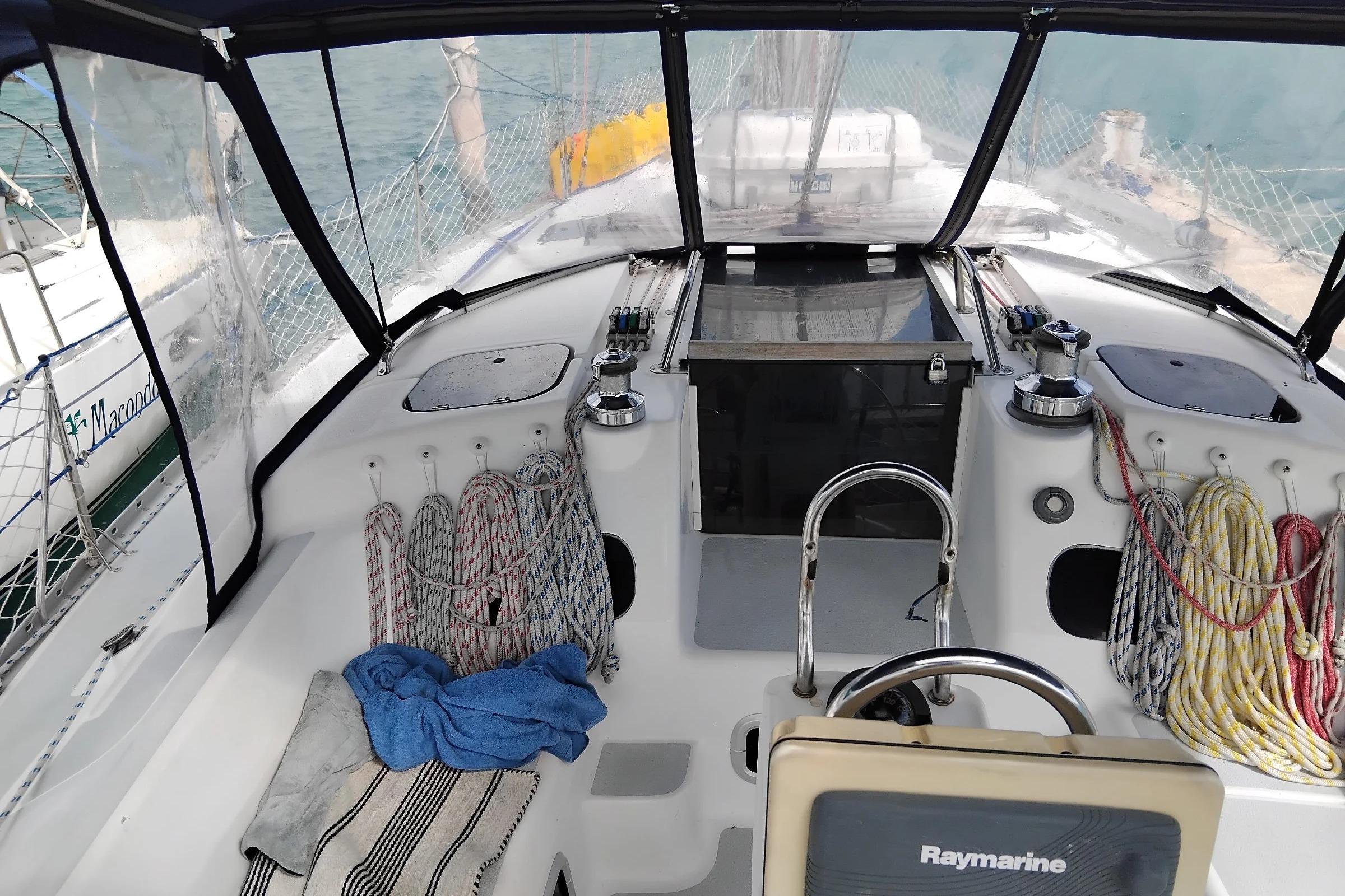 Cockpit of 1994 Hunter Legend 40.5 sailboat with ropes and navigation equipment.