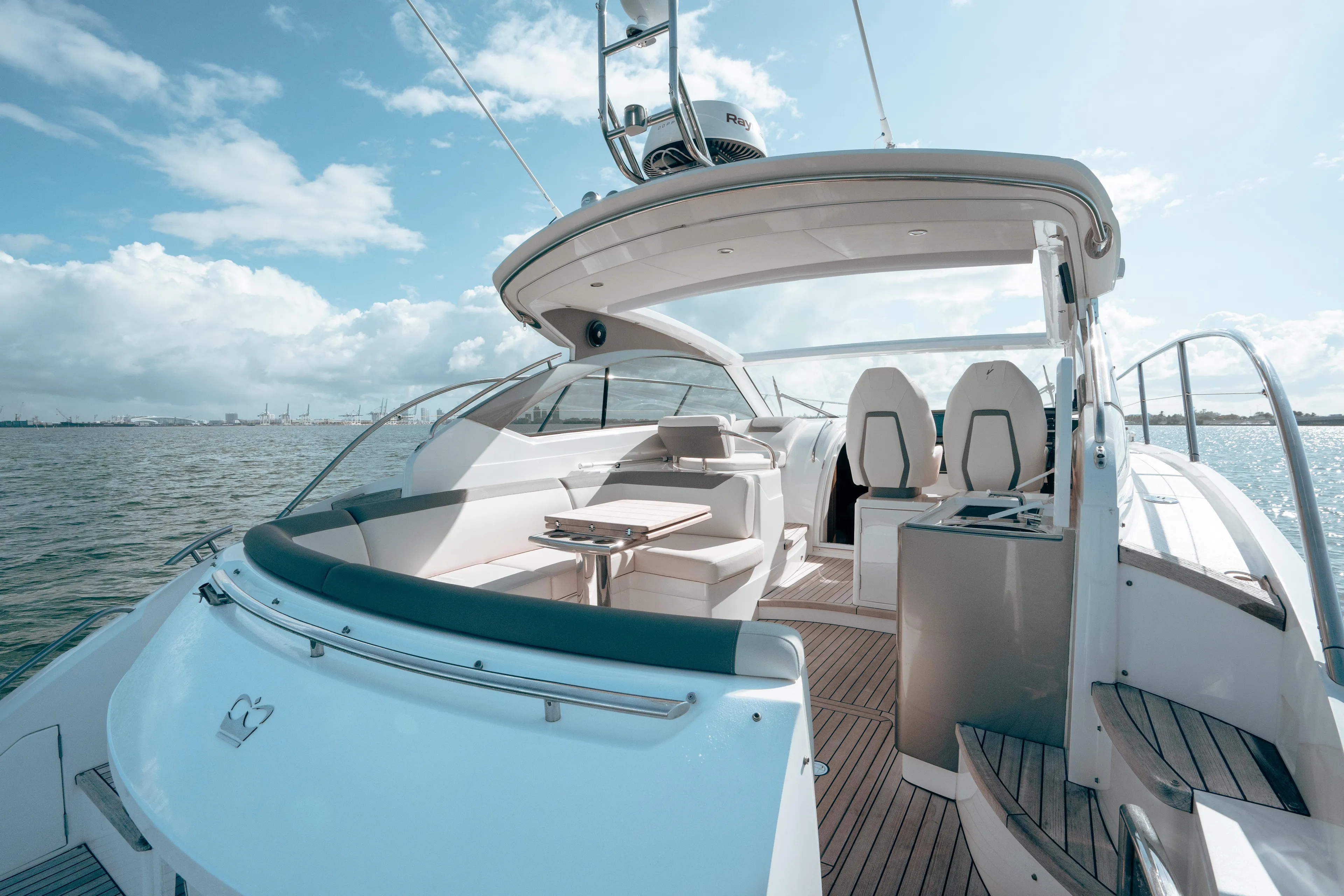 Angeliki Yacht Photos Pics Luxurious 2021 Princess V40 yacht with spacious deck and seating, cruising on open water.