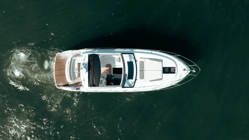 Angeliki Yacht Photos Pics Aerial view of 2021 Princess V40 yacht cruising on open water.