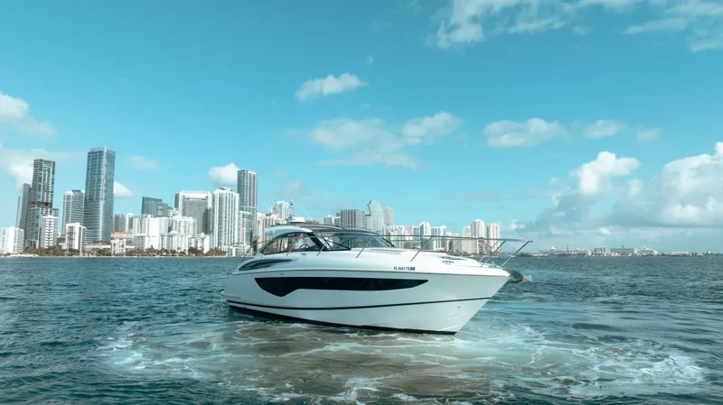 Angeliki Yacht Photos Pics Princess V40 yacht cruising near city skyline, 2021 model.