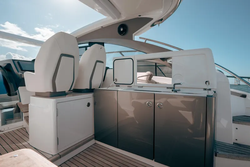 Angeliki Yacht Photos Pics Luxury yacht interior with sleek design, featuring modern seating and cabinetry, Princess V40 2021 model.