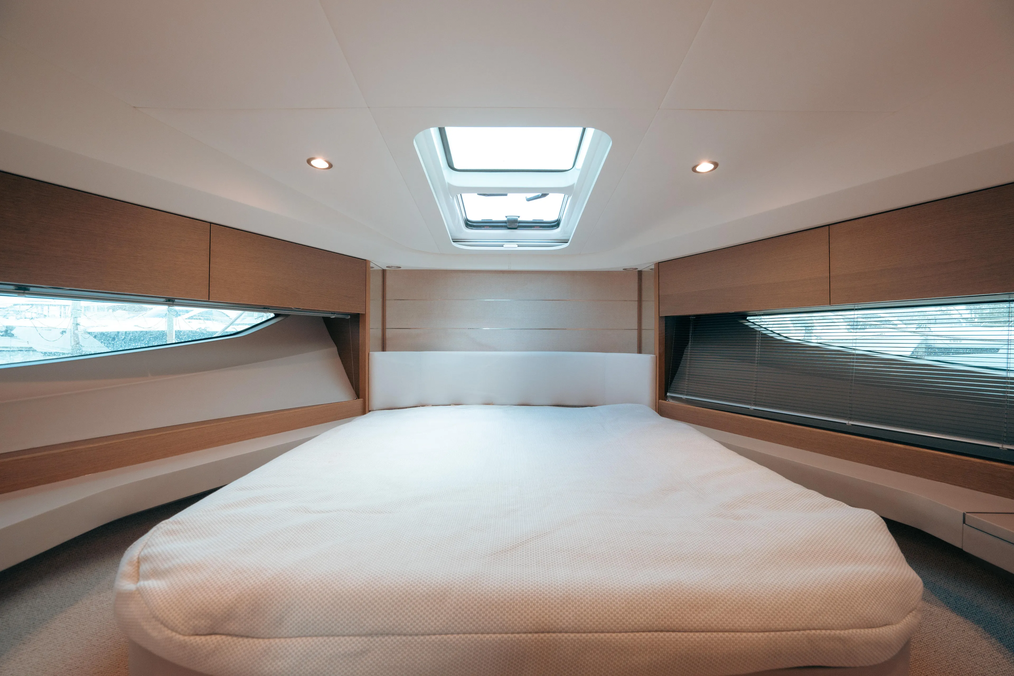 Angeliki Yacht Photos Pics Luxurious cabin interior of 2021 Princess V40 yacht with skylight and modern design.