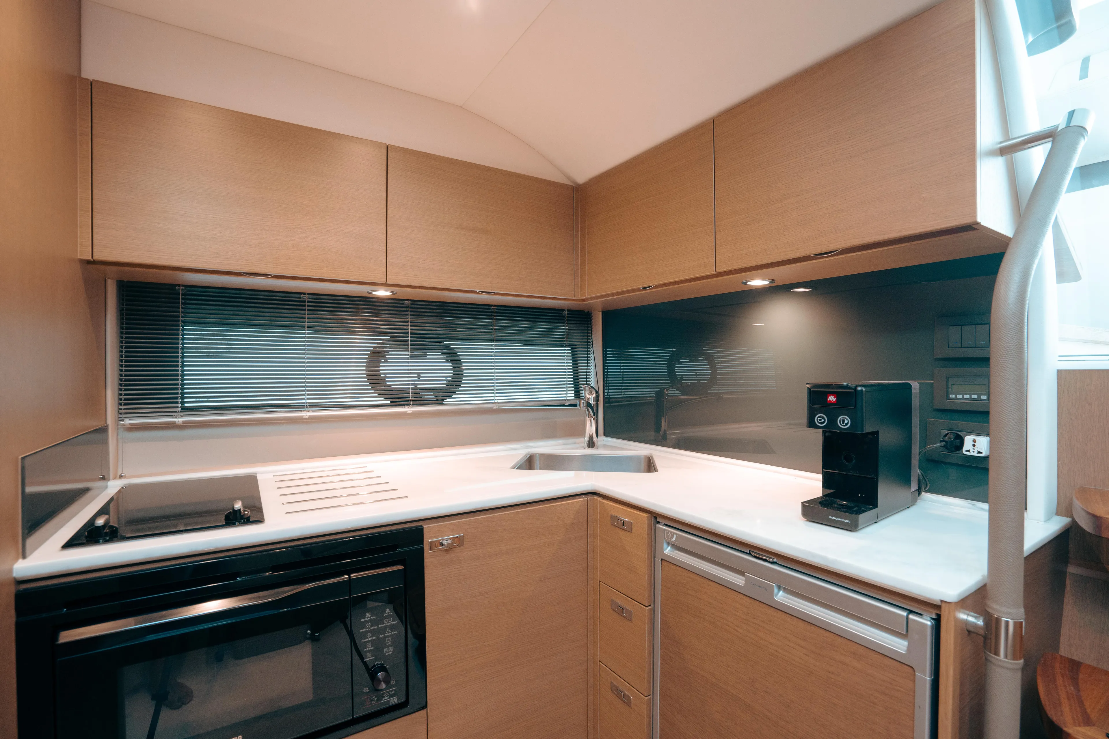 Angeliki Yacht Photos Pics Modern kitchen in 2021 Princess V40 yacht with sleek cabinetry and appliances.