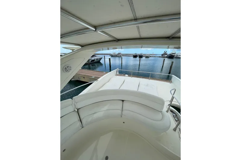  Yacht Photos Pics Flybridge view of 2005 Azimut 55 yacht, overlooking marina with multiple boats docked.