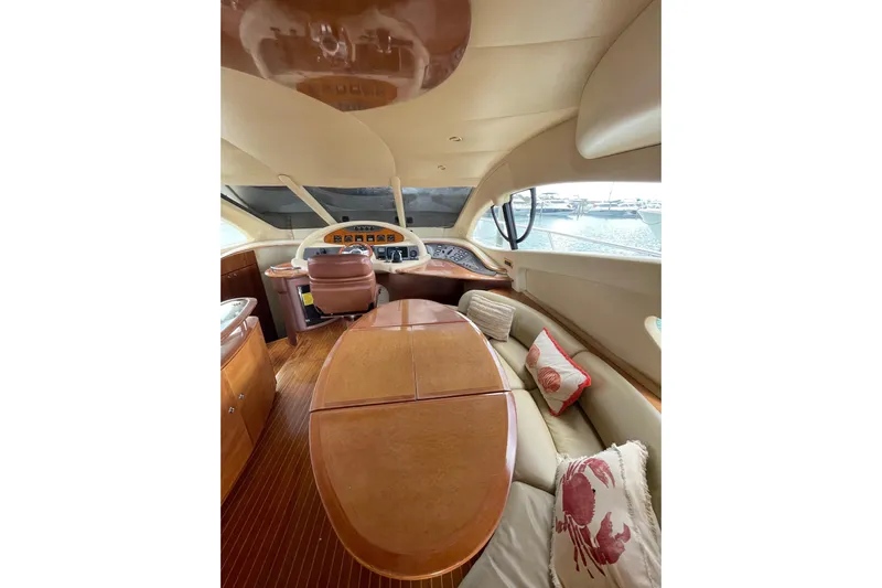  Yacht Photos Pics Luxurious interior of a 2005 Azimut 55 Flybridge yacht with elegant wood finishes.