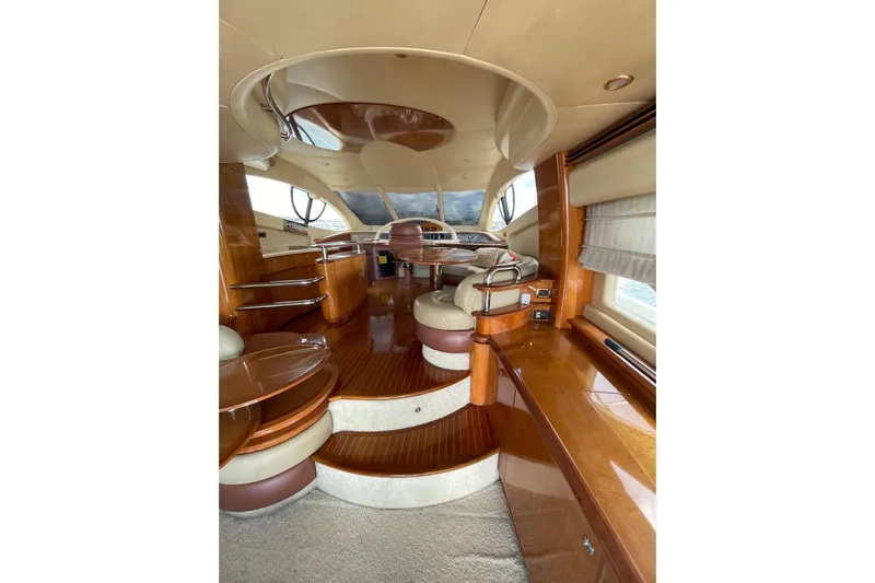  Yacht Photos Pics Luxurious interior of 2005 Azimut 55 Flybridge yacht with elegant wood finishes.
