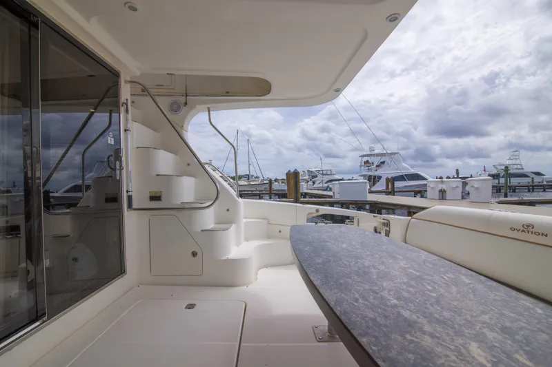 Immersed Yacht Photos Pics 2009 Silverton Oviation 52 yacht interior with elegant seating and marina view.