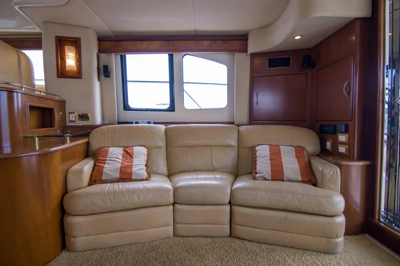 Immersed Yacht Photos Pics Luxurious interior of 2009 Silverton Oviation 52 yacht with beige leather sofa.