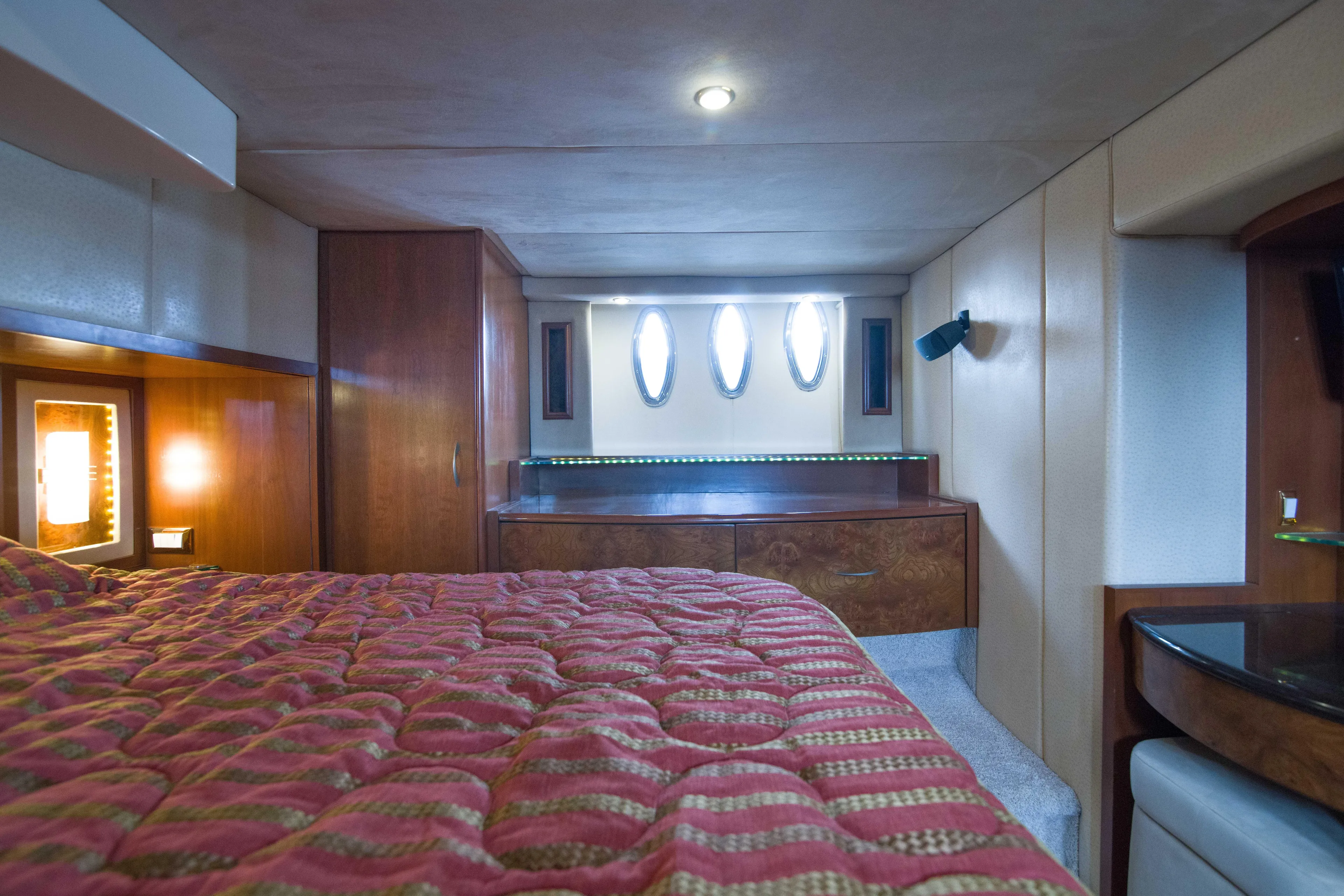 Immersed Yacht Photos Pics Luxurious cabin interior of 2009 Silverton Oviation 52 yacht with elegant wood finishes.