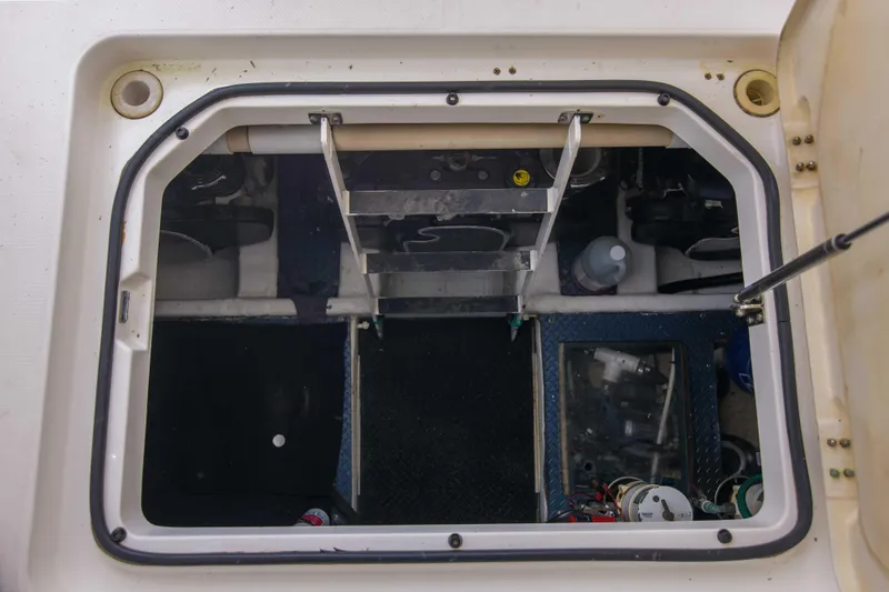 Immersed Yacht Photos Pics Engine compartment of 2009 Silverton Oviation 52 yacht, showing access hatch and equipment.