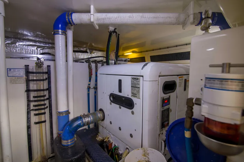 Immersed Yacht Photos Pics Engine room of 2009 Silverton Oviation 52 yacht with visible machinery and piping.