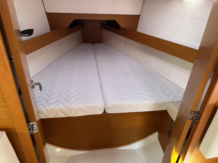  Yacht Photos Pics Cabin interior of 2020 Jeanneau Sun Odyssey 349 with comfortable double bed.