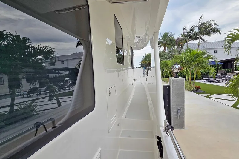 Suertudo Yacht Photos Pics 2020 Outer Reef Yachts 720 Motoryacht side deck with tropical background.