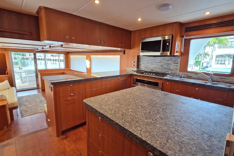 Suertudo Yacht Photos Pics Luxurious kitchen interior of 2020 Outer Reef Yachts 720 Motoryacht with modern appliances.