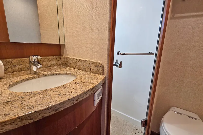 Suertudo Yacht Photos Pics Luxurious bathroom in 2020 Outer Reef Yachts 720 Motoryacht with granite countertop and shower.