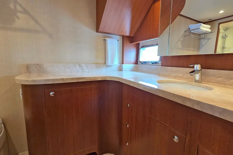 Suertudo Yacht Photos Pics Luxurious bathroom in 2020 Outer Reef Yachts 720 Motoryacht with elegant wood cabinetry.