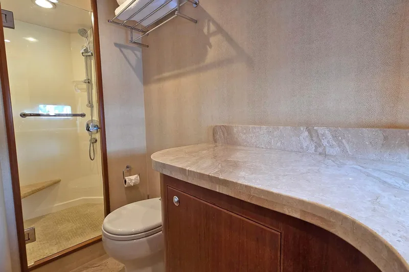 Suertudo Yacht Photos Pics Luxurious bathroom in 2020 Outer Reef Yachts 720 Motoryacht with marble countertop and shower.