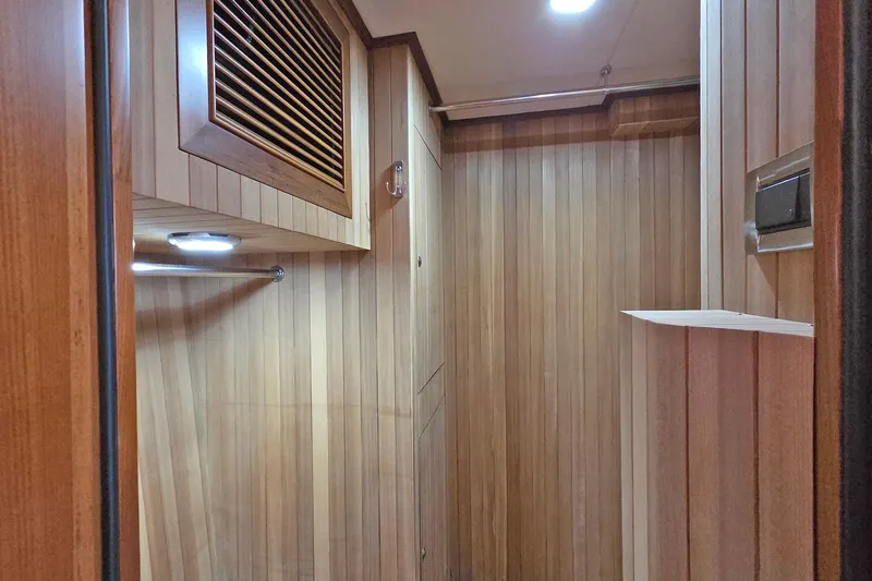 Suertudo Yacht Photos Pics 2020 Outer Reef Yachts 720 Motoryacht interior with wooden paneling and modern lighting.