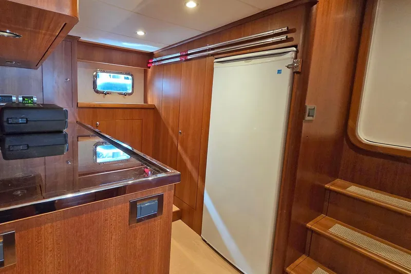 Suertudo Yacht Photos Pics Luxurious interior of 2020 Outer Reef Yachts 720 Motoryacht with wood paneling and modern amenities.