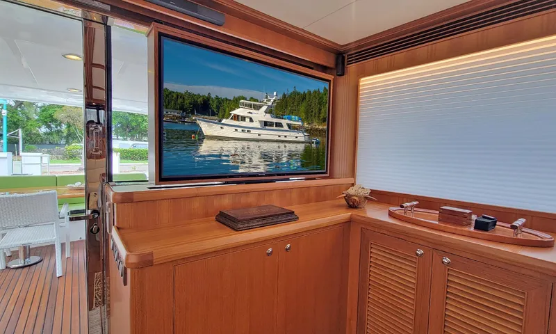 Suertudo Yacht Photos Pics Luxurious interior of 2020 Outer Reef Yachts 720 Motoryacht with scenic view on screen.