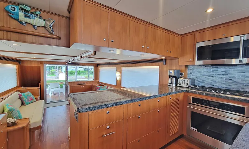 Suertudo Yacht Photos Pics Luxurious kitchen interior of 2020 Outer Reef Yachts 720 Motoryacht with modern appliances.