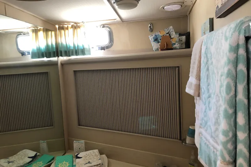  Yacht Photos Pics Bathroom interior of 1988 Tollycraft 40 Sundeck Motor Yacht with nautical decor.