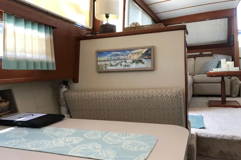  Yacht Photos Pics Interior of 1988 Tollycraft 40 Sundeck Motor Yacht with cozy seating and decor.