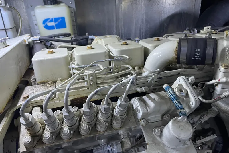  Yacht Photos Pics Engine components of a 1988 Tollycraft 40 Sundeck Motor Yacht, showcasing intricate mechanical details.