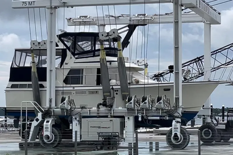  Yacht Photos Pics 1988 Tollycraft 40 Sundeck Motor Yacht on a boat lift at a marina.