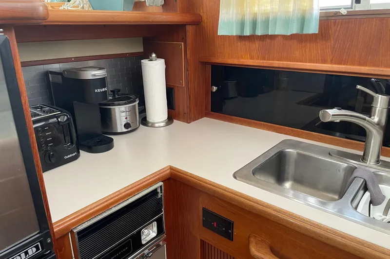  Yacht Photos Pics 1988 Tollycraft 40 Sundeck Motor Yacht kitchen with appliances and sink.