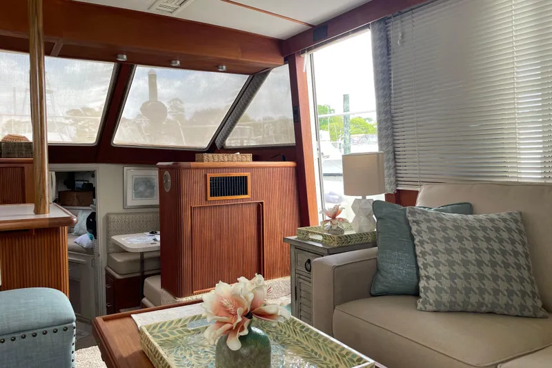  Yacht Photos Pics Interior of 1988 Tollycraft 40 Sundeck Motor Yacht with cozy seating and decor.