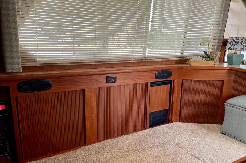 Yacht Photos Pics 1988 Tollycraft 40 Sundeck Motor Yacht interior with wood paneling and blinds.