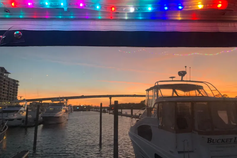  Yacht Photos Pics 1988 Tollycraft 40 Sundeck Motor Yacht at sunset with colorful lights.