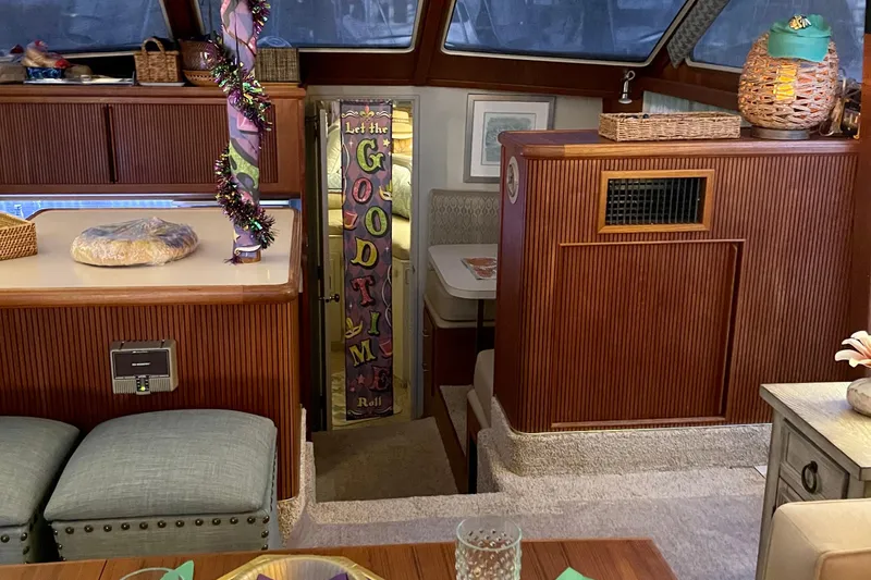  Yacht Photos Pics Interior of 1988 Tollycraft 40 Sundeck Motor Yacht with festive decor and cozy seating.
