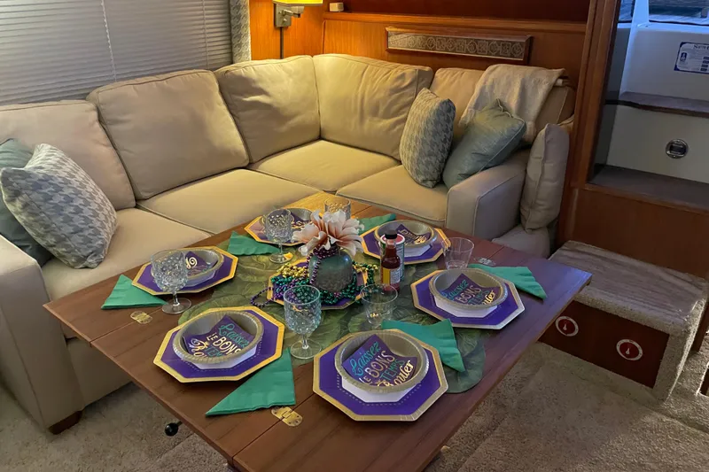  Yacht Photos Pics Cozy dining setup on 1988 Tollycraft 40 Sundeck Motor Yacht with festive tableware.